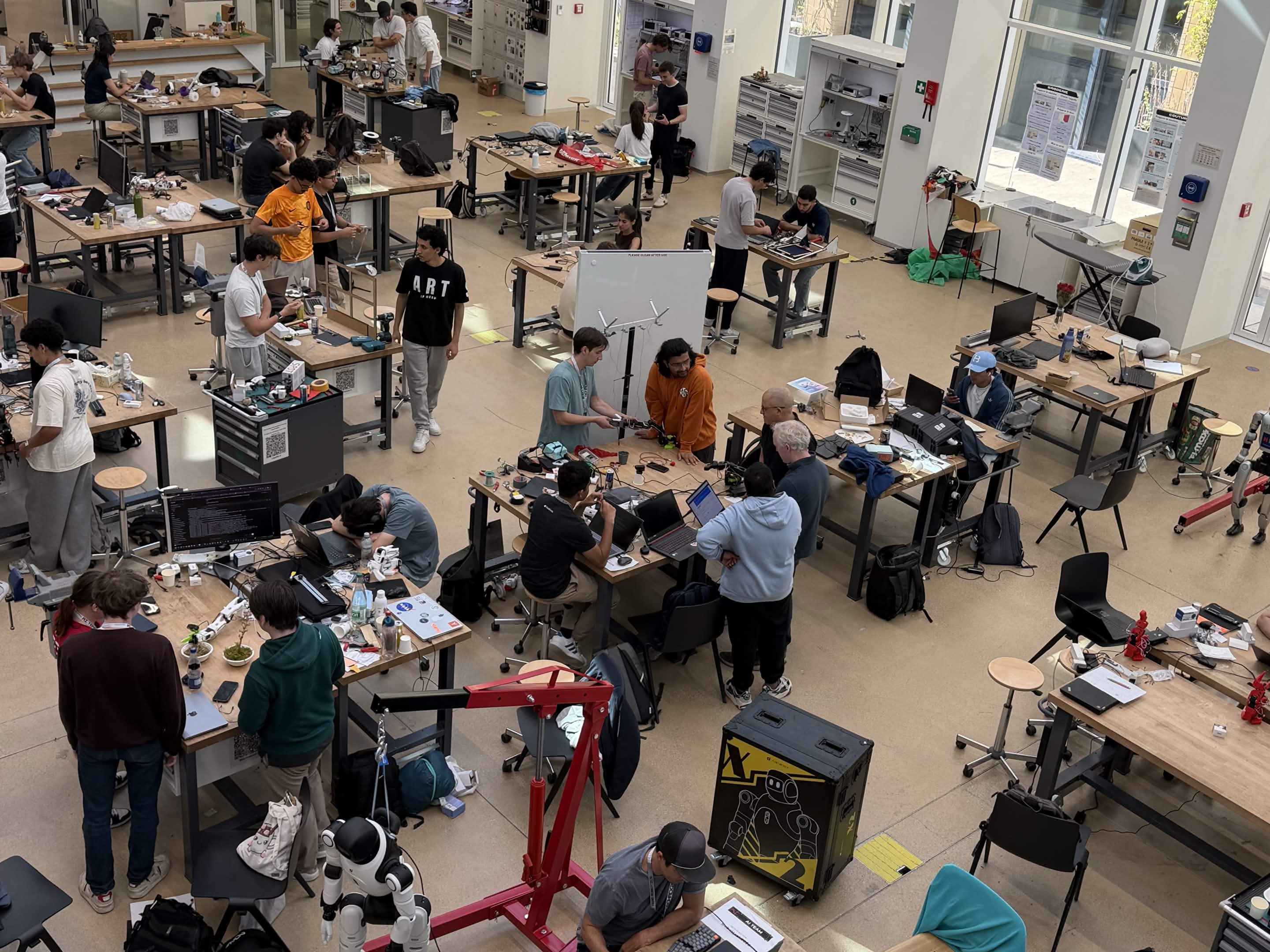 Builders working on hardware in the lab